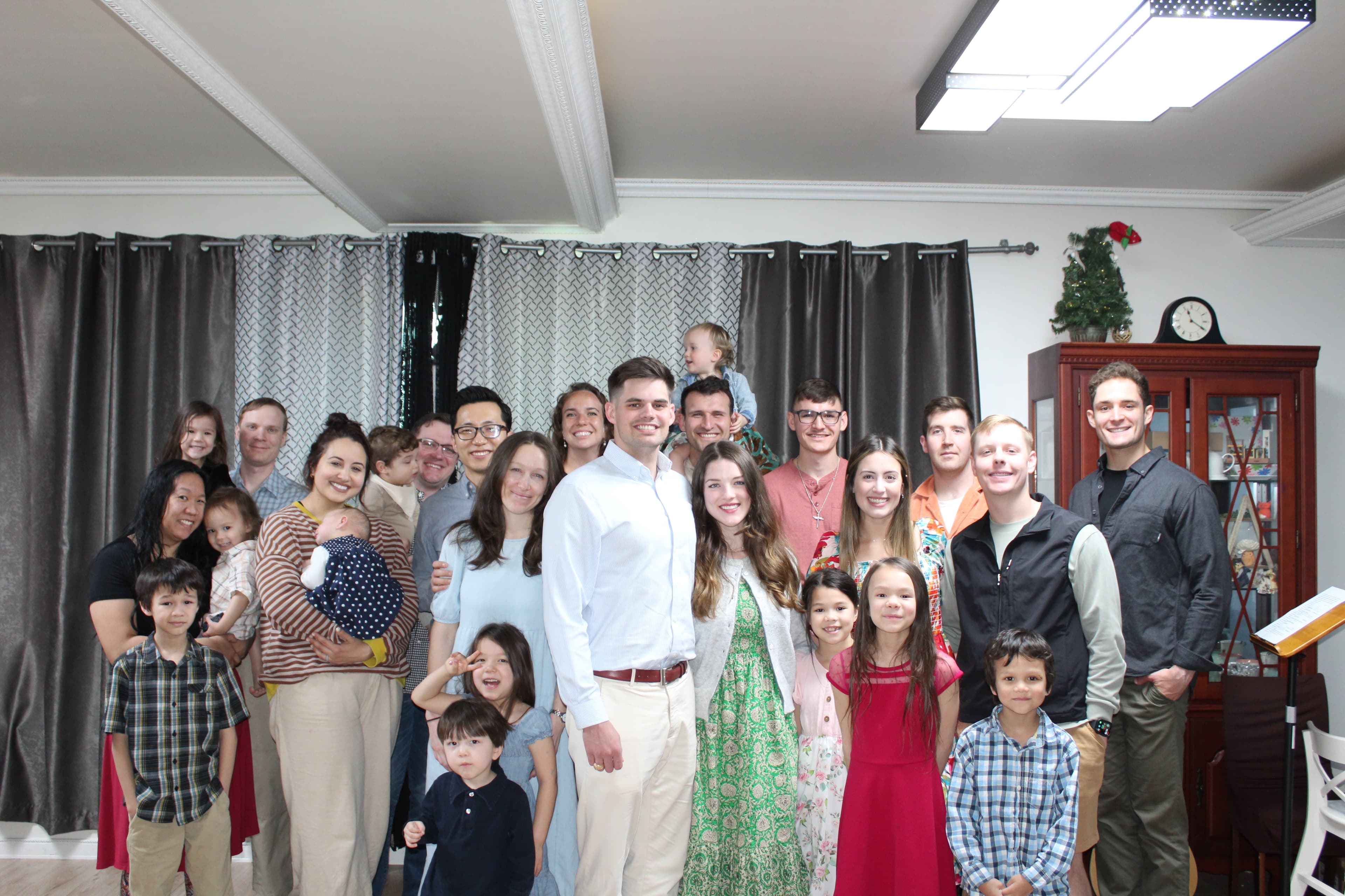 Jae and Jesslyn gathered with a church community of adults and children